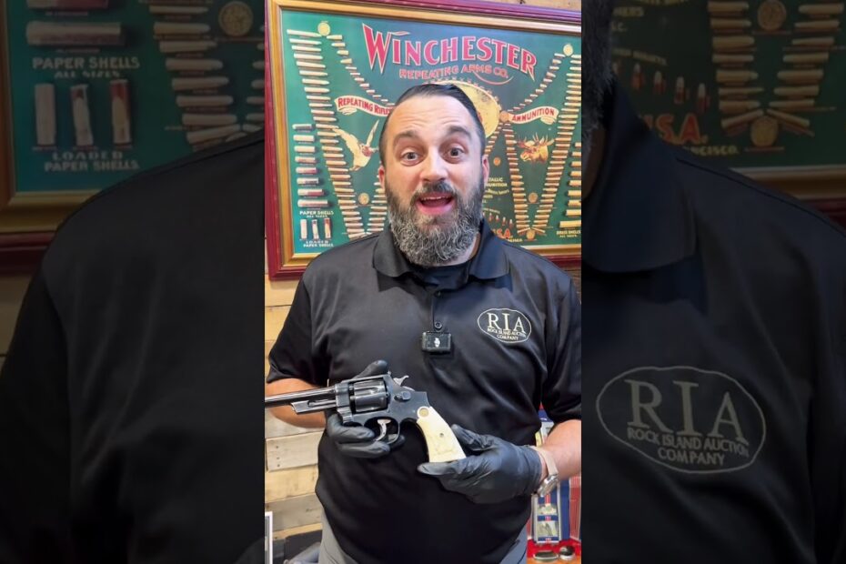 The Smith & Wesson Triple-lock with craved ivory grips.