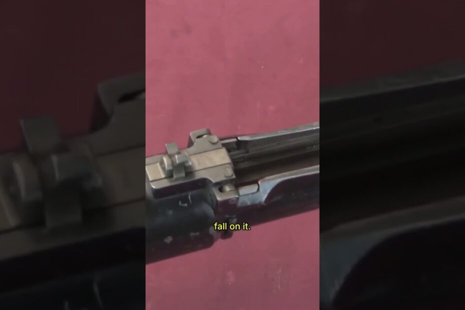 Watch the MG‑15 cycle  open‑bolt operation, reciprocating charging handle, and downward ejection